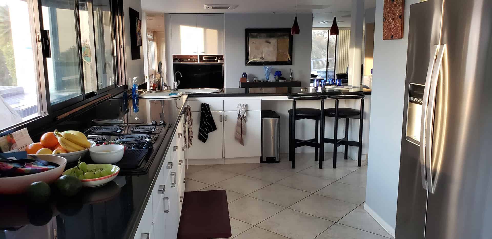 white kitchen with black accent
