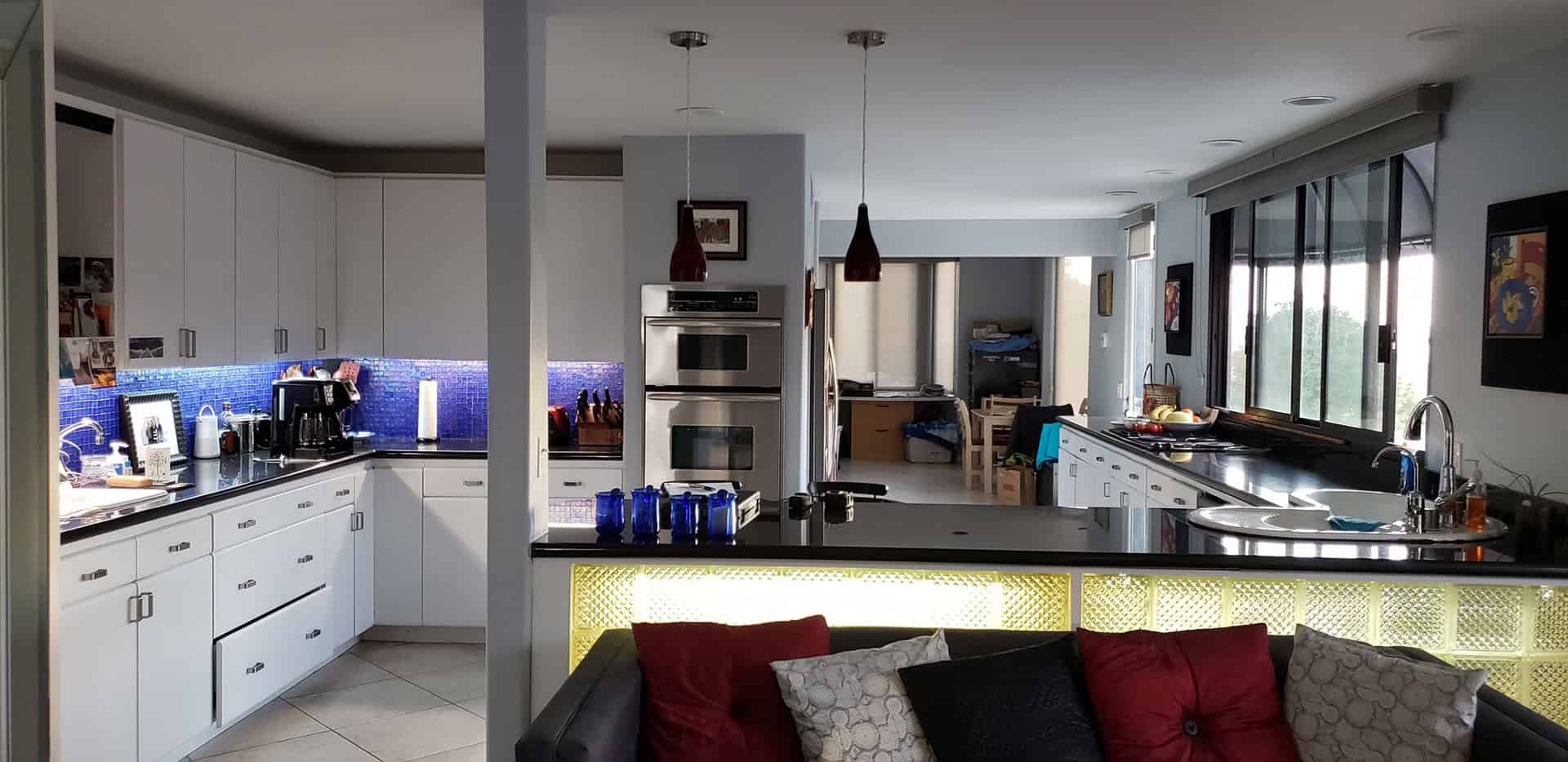 spacious kitchen with blue lighting