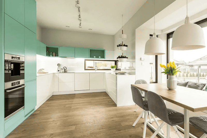 white kitchen with green accent details