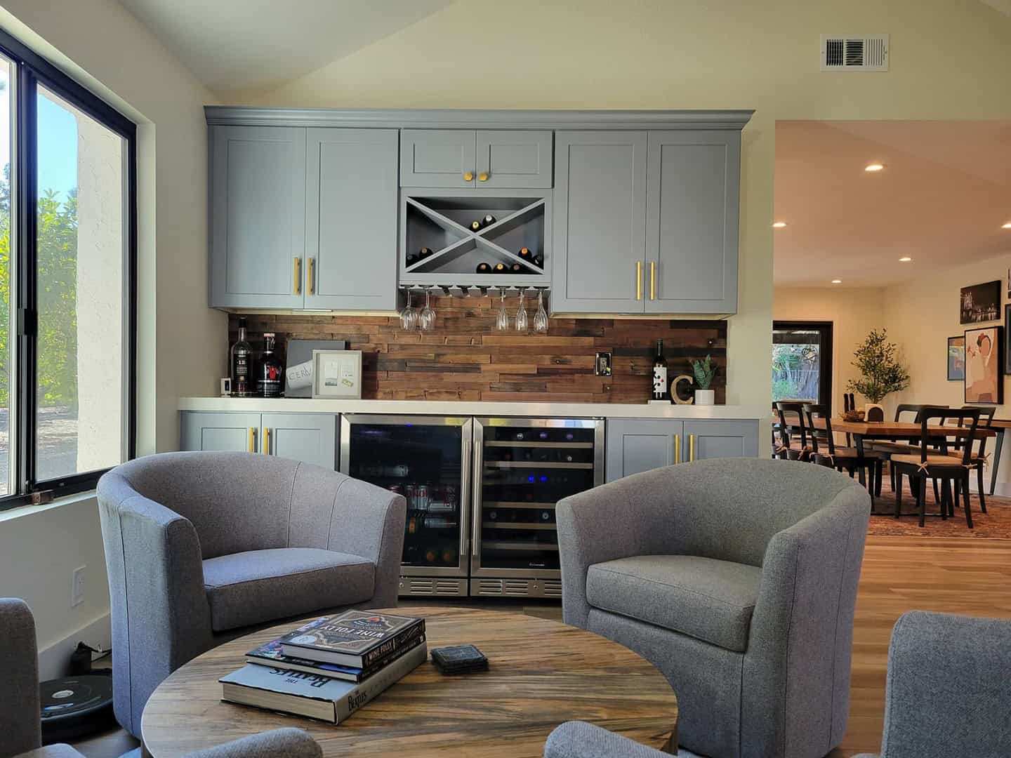 gray armchairs near the round table