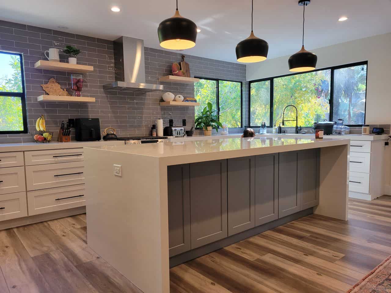 gray island with a white countertop