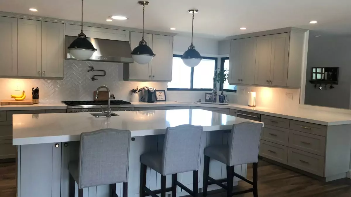 Contemporary light grey kitchen with white tile herringbone backsplash makeover | Groysman Construction Remodeling | 1