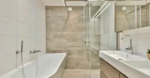 white beige bathroom with shower cabin