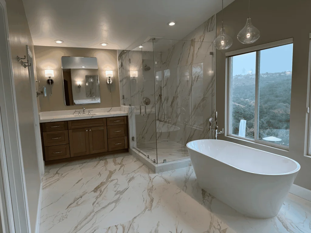 white bath near window with marble floor