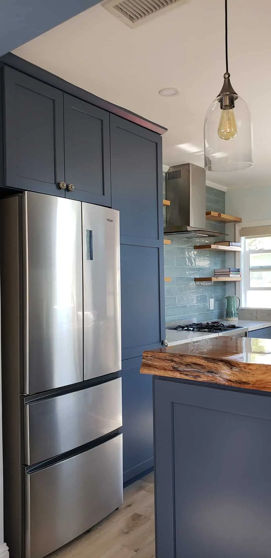 grey kitchen with large fridge