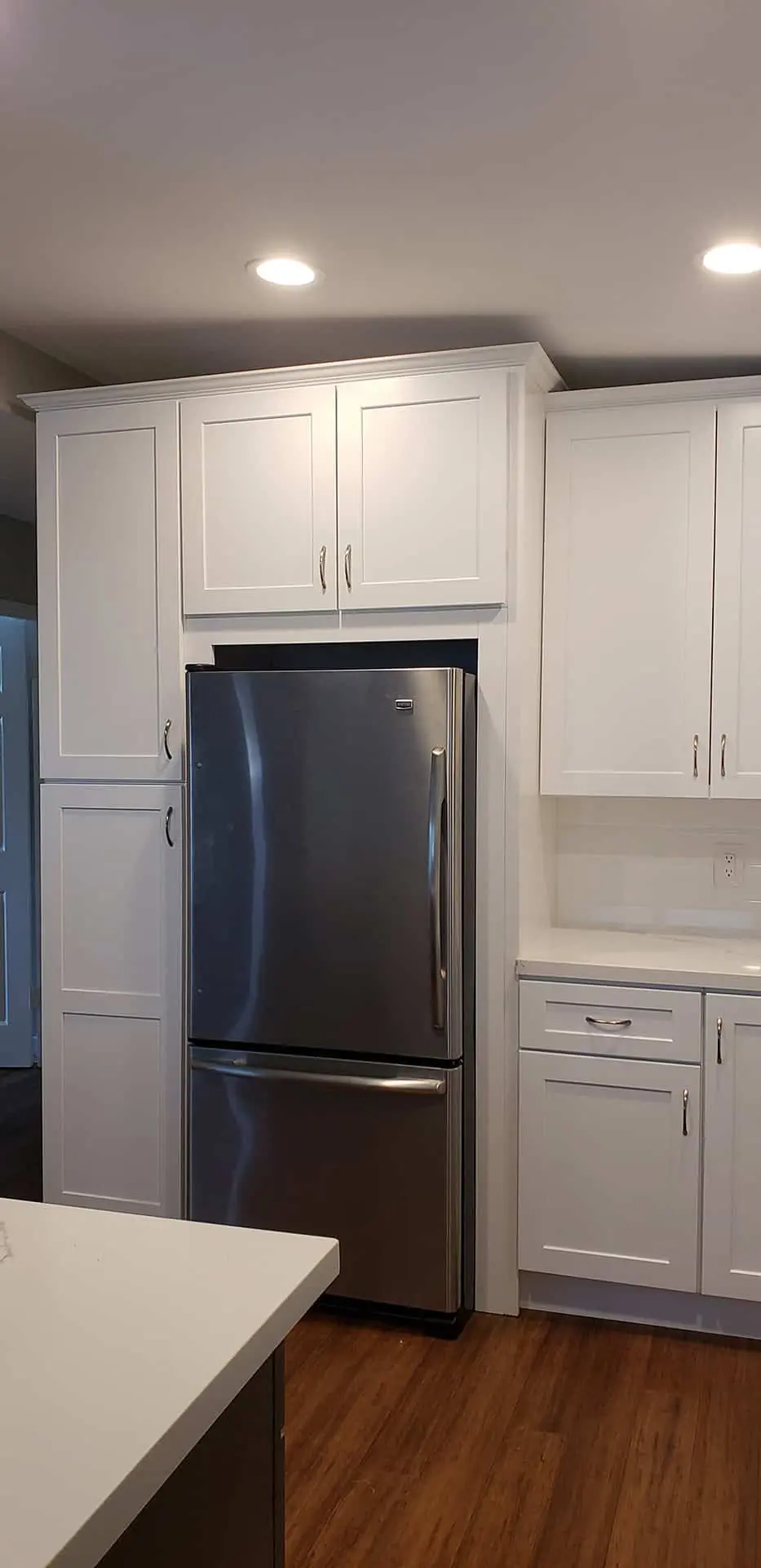 white kitchen with silver handles