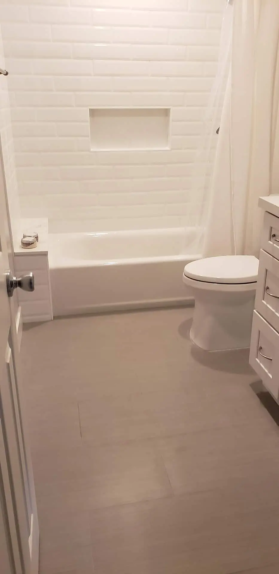 white toilet near dresser