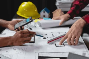 two men making changes to the construction project