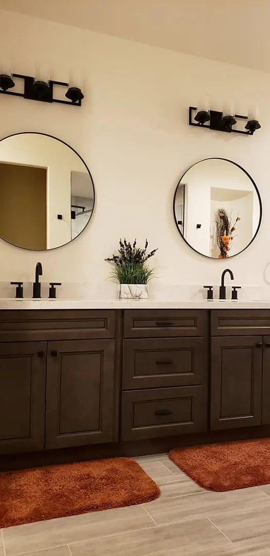 round mirrors above the sinks