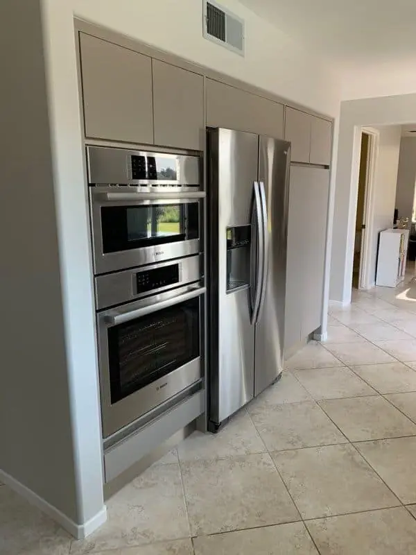 silver appliances in a matte gray kitchen