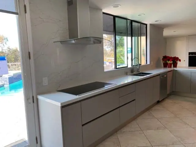 large window near the kitchen sink