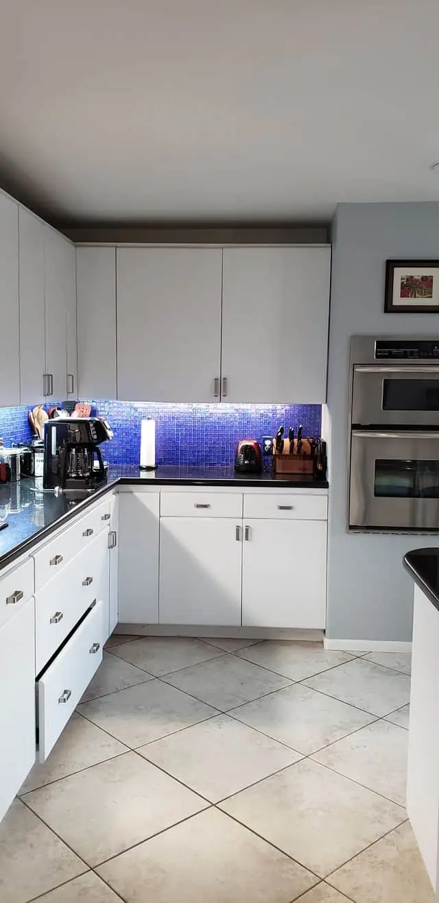 dark backsplash in a white kitchen