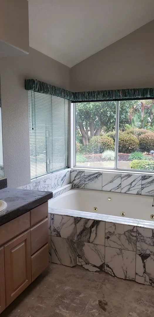 a marble bathroom near the window