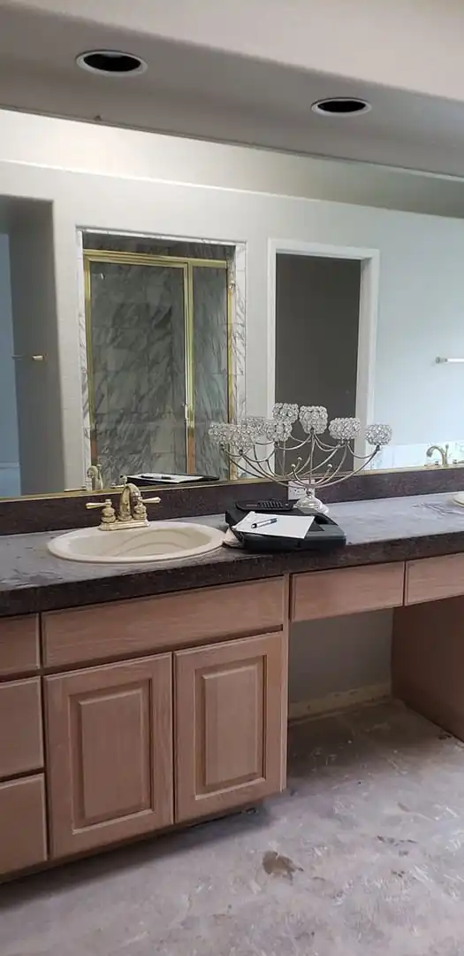 a round washbasin with gold hardware