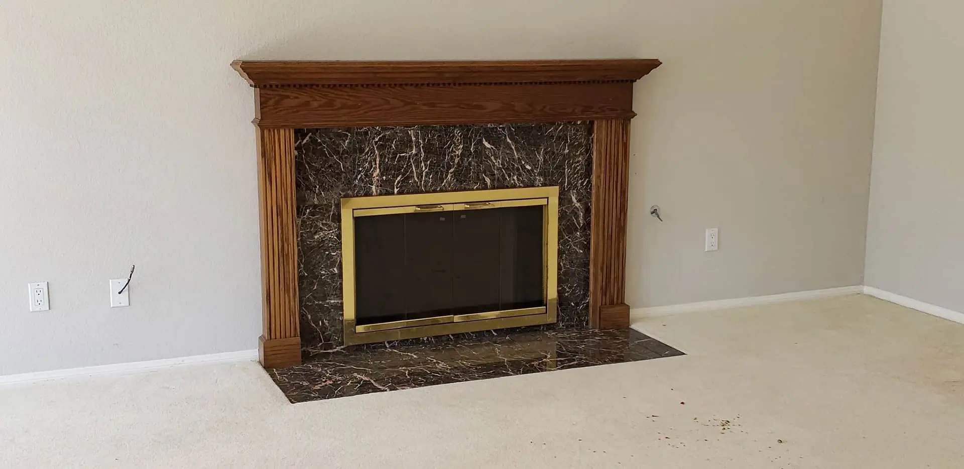 a fireplace with a wooden frame