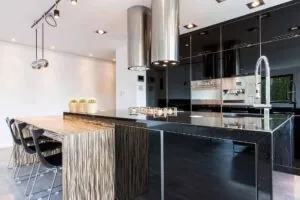 black kitchen cabinets with white walls