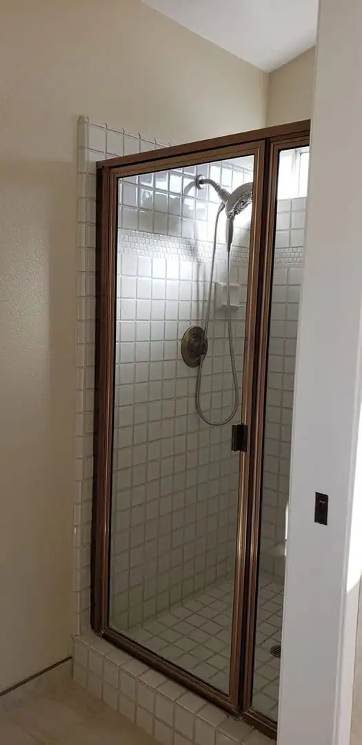 shower with white tiles