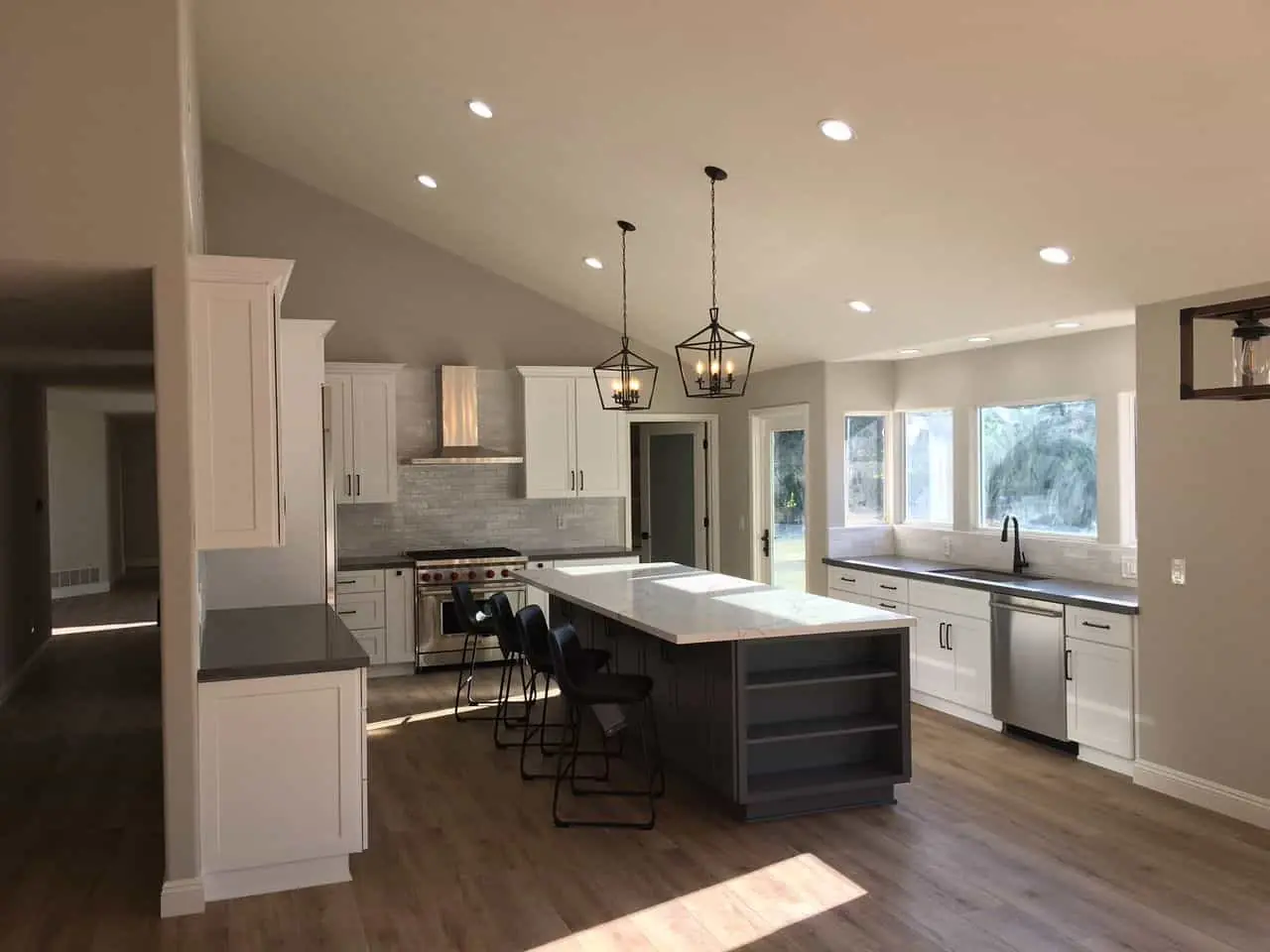 a kitchen in beige tones with a gray island