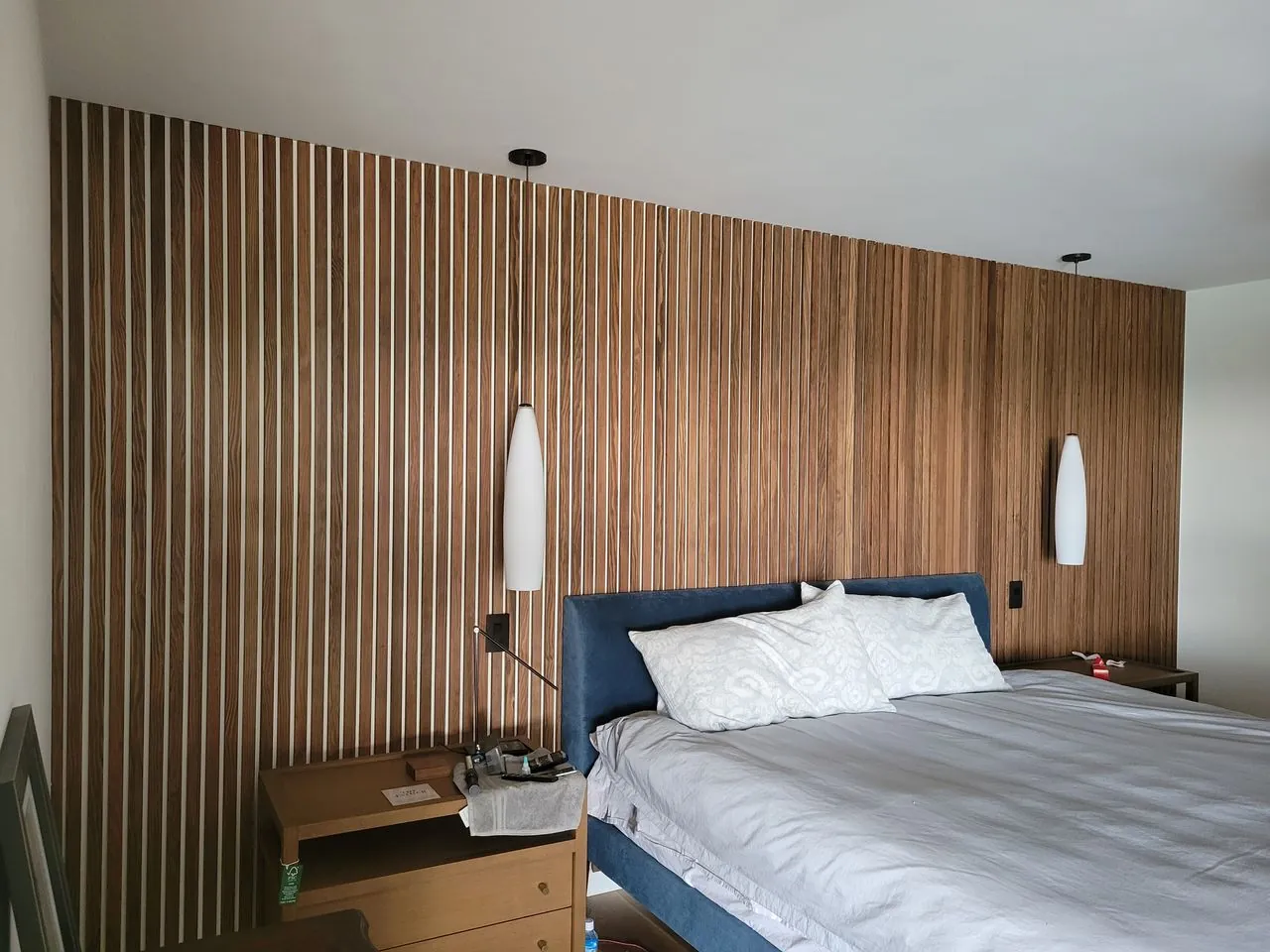bedroom wall finished with wooden slats