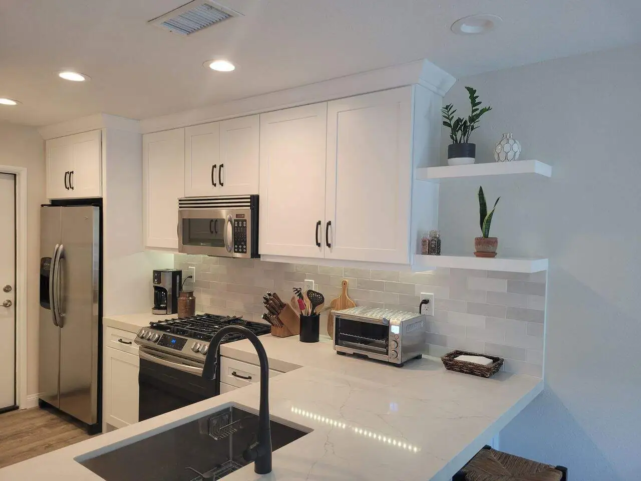 built-in refrigerator in a white kitchen