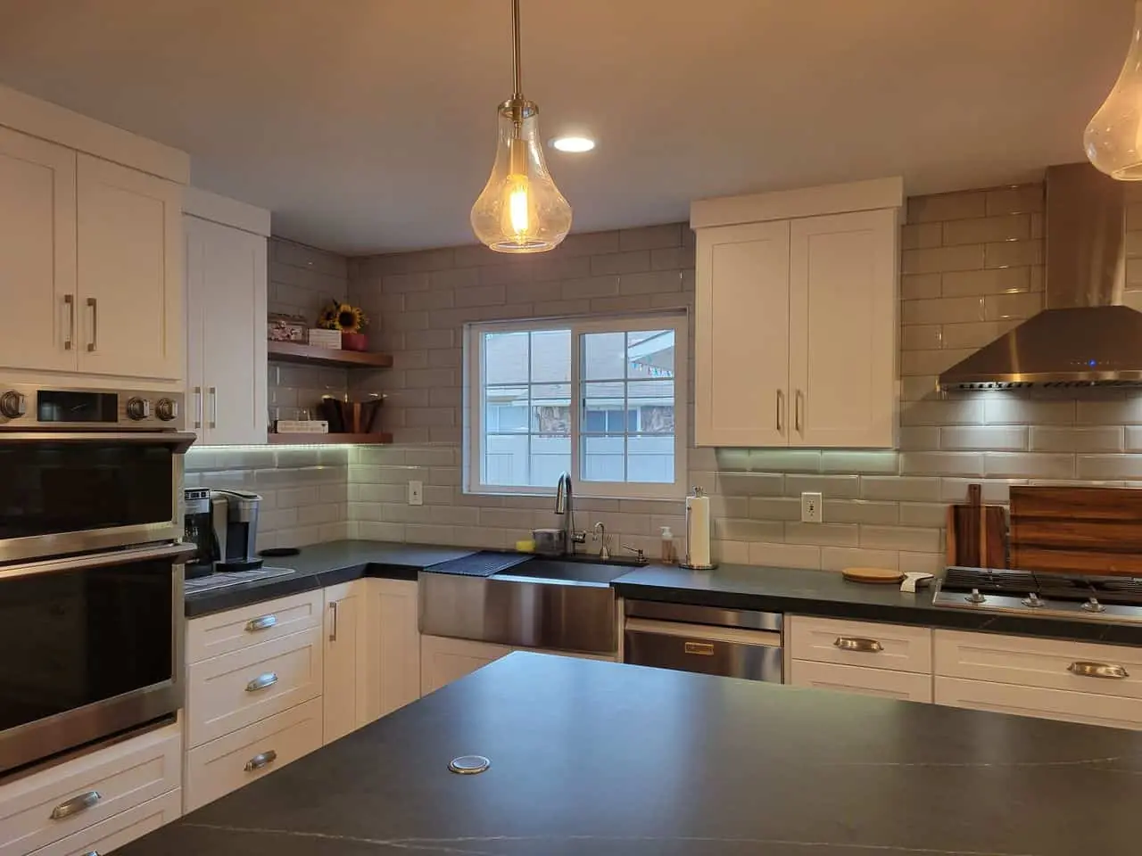 open storage shelves in the kitchen near the window