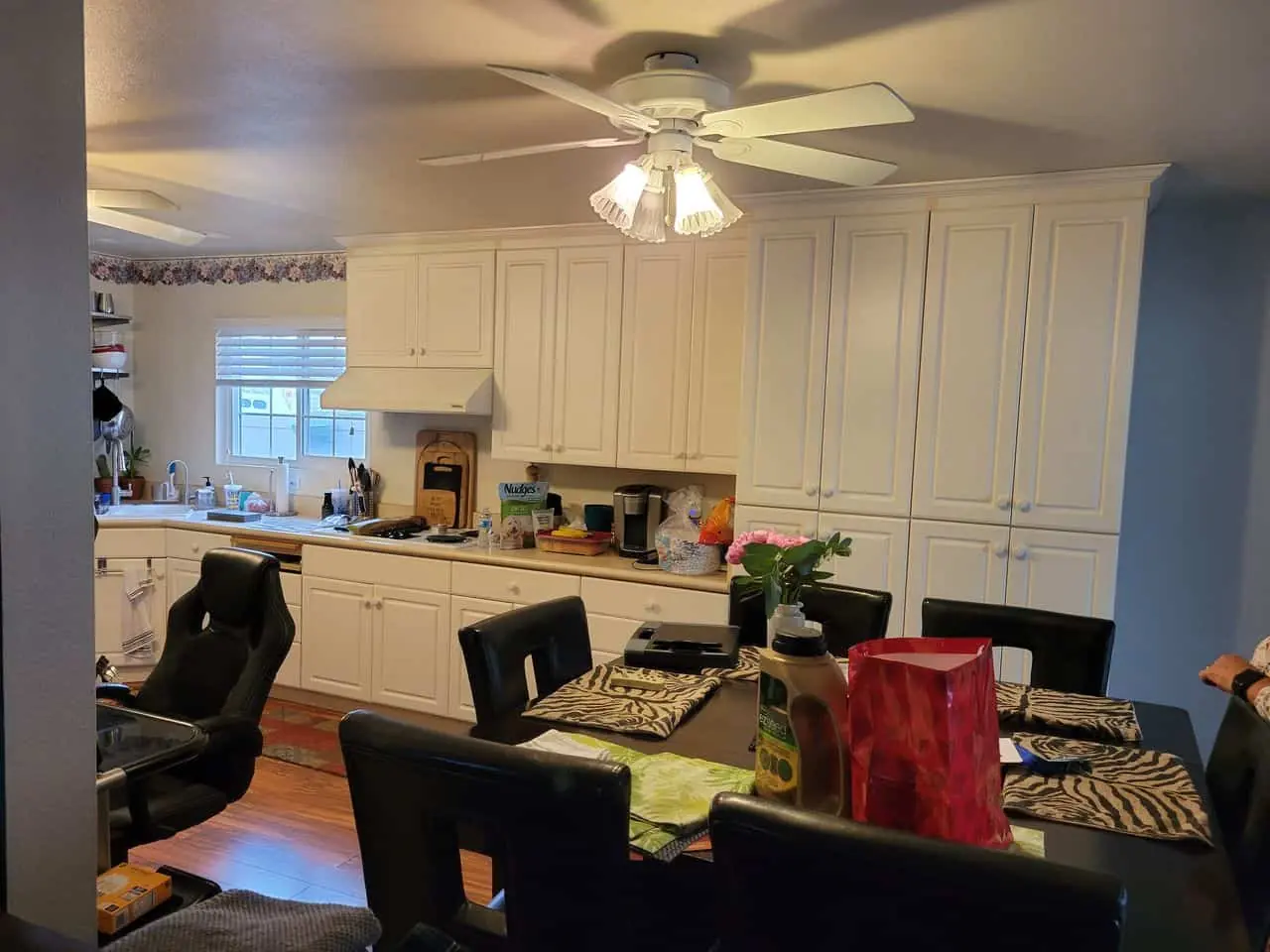 contrasting black table in a white kitchen