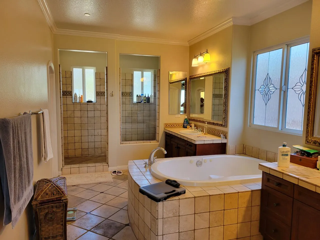 in warm tones bathroom with a large mirror