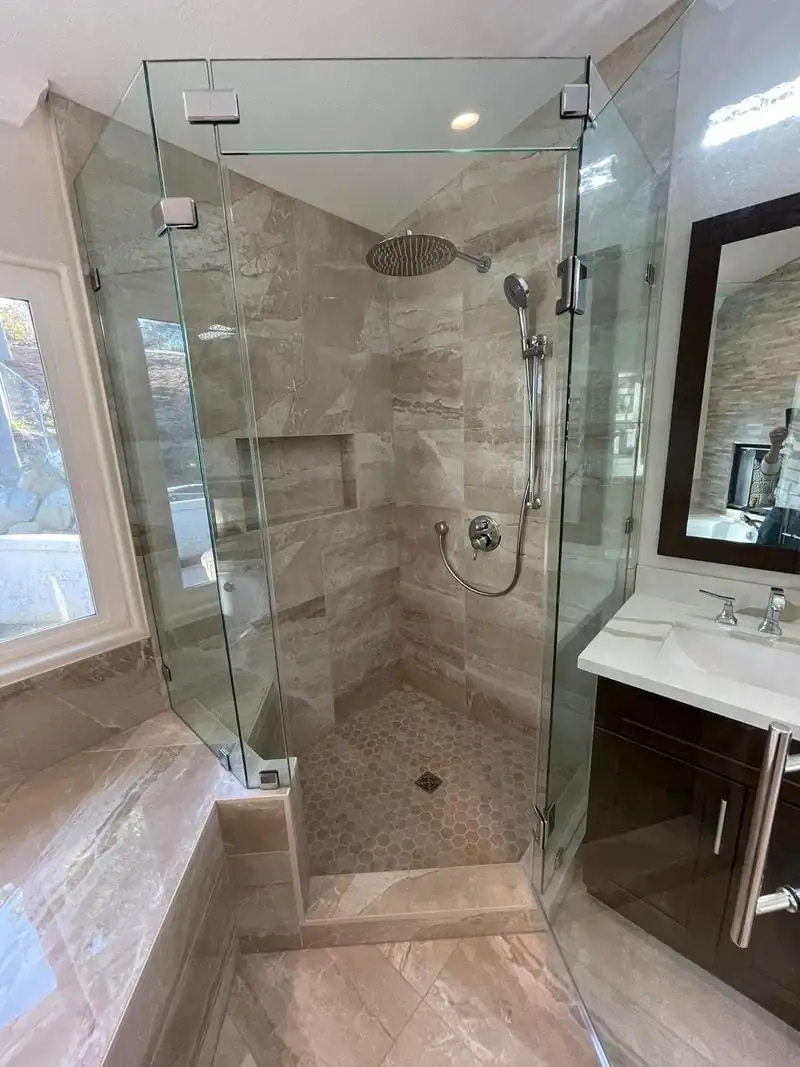 a corner shower in beige tones