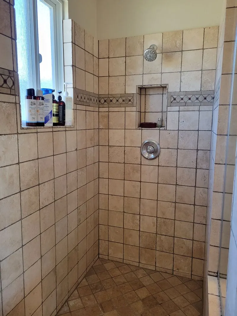shower in light brown tiles