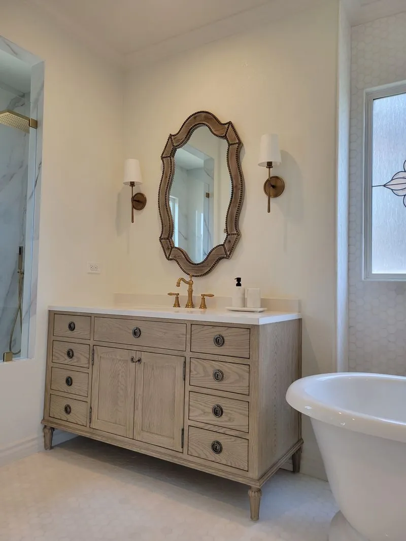 light-colored dresser/vanity next to the bathtub