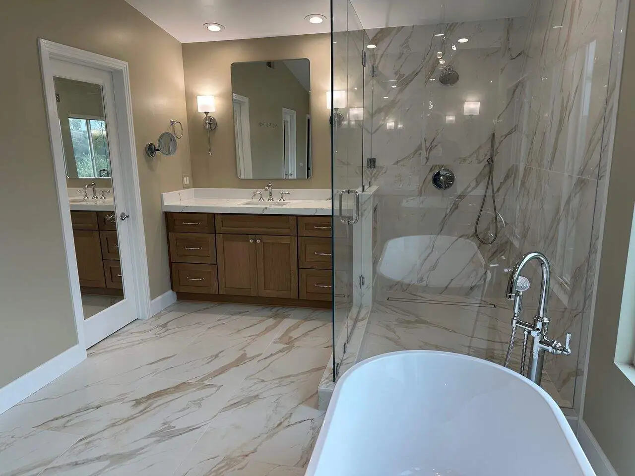 wooden cabinet in a marble bathroom