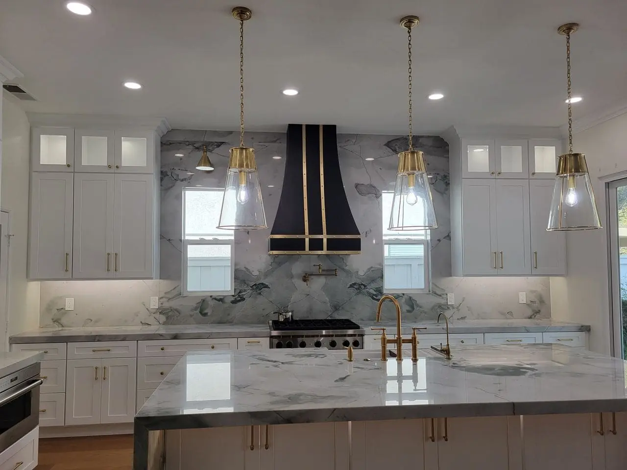 gold pendant lights above the countertop