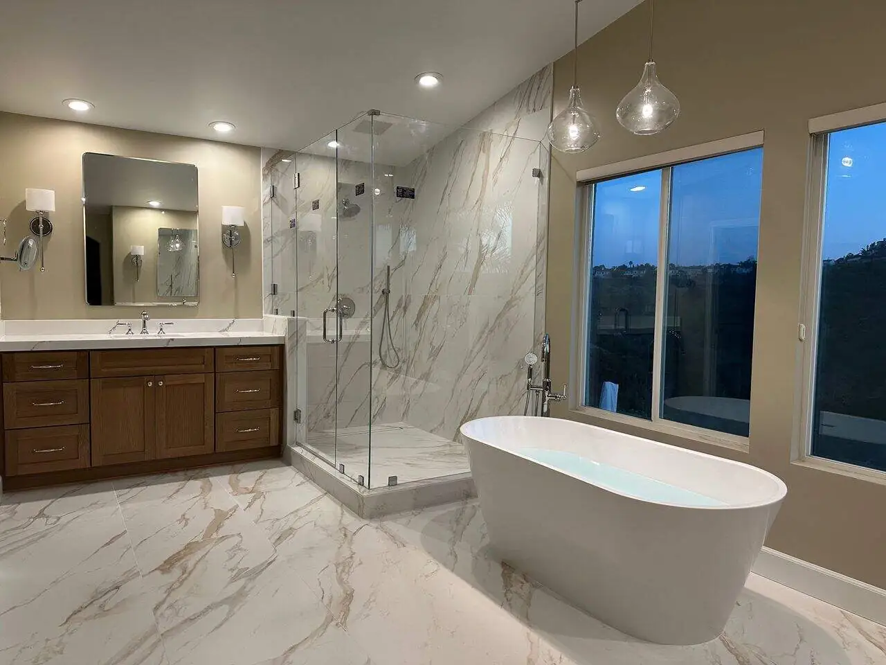 bathroom in cream marble tones in the evening