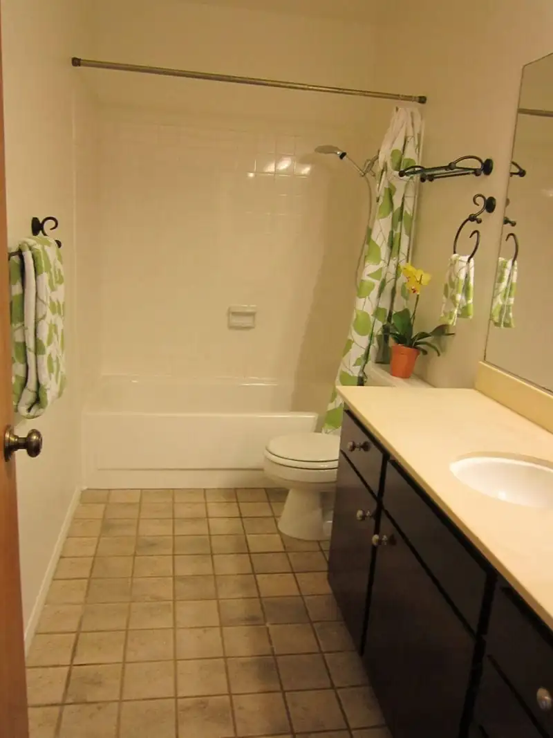 bathroom with a green curtain