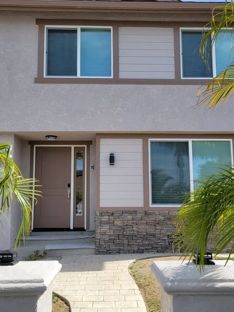 beige house with large windows