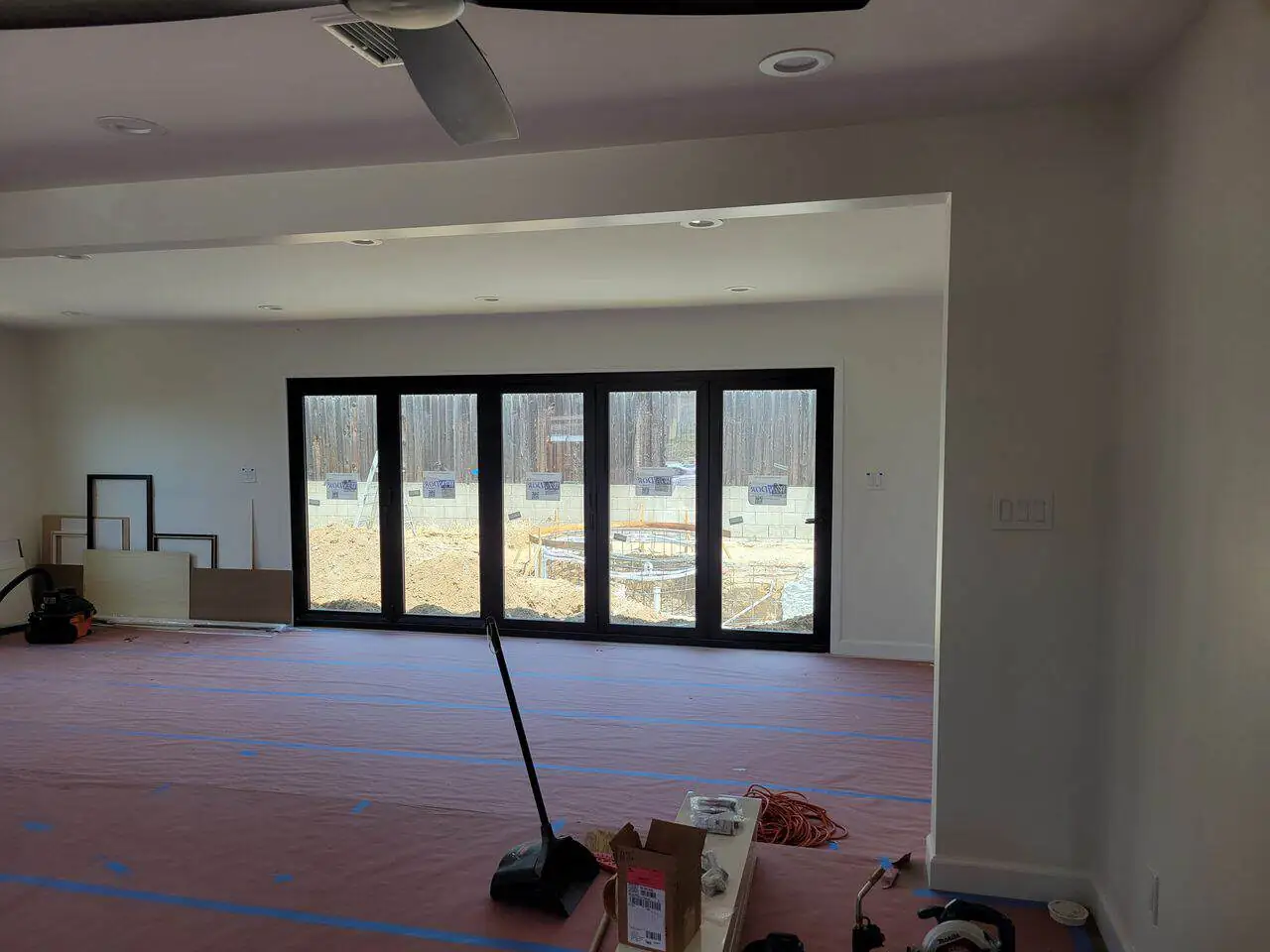 spacious living room with floor-to-ceiling windows