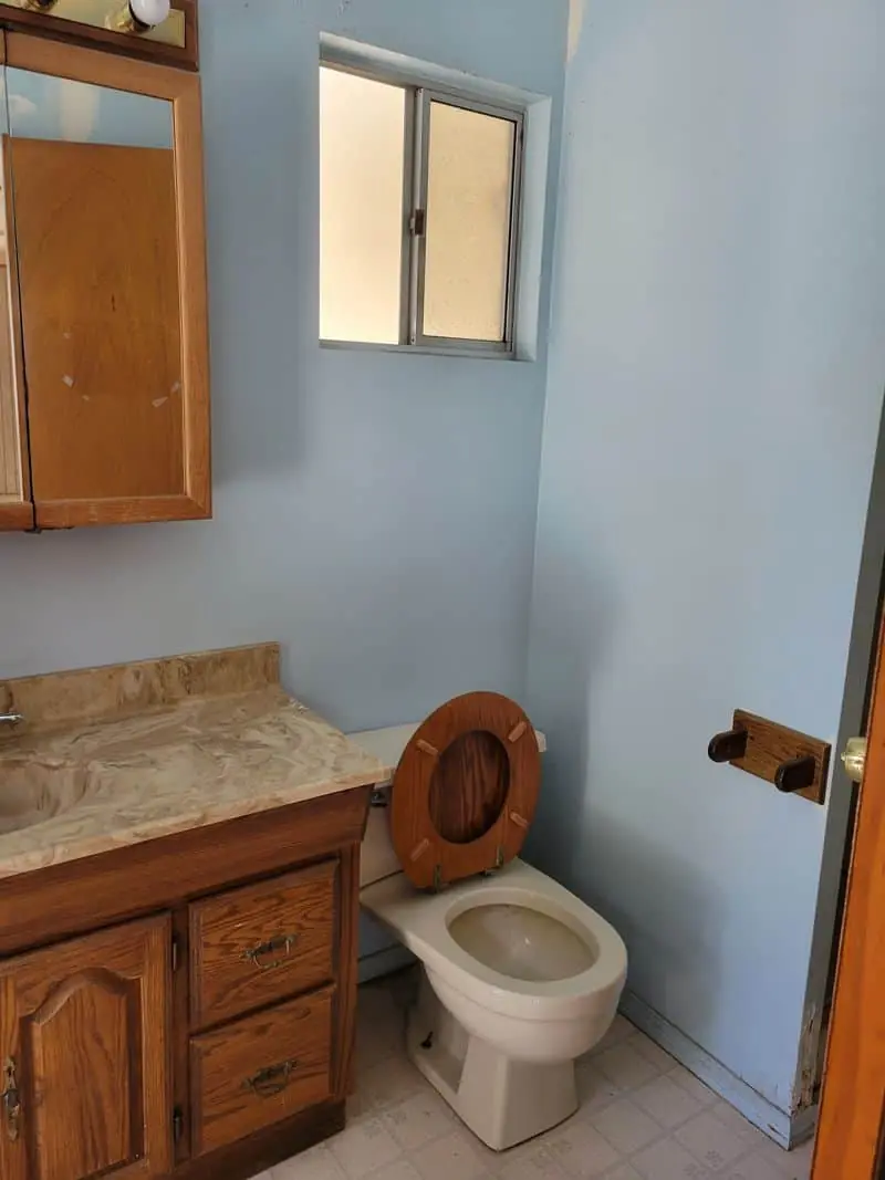 bathroom with wooden accents