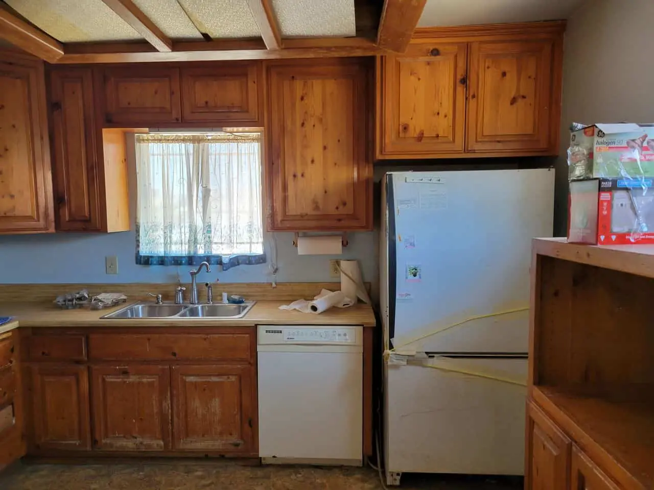 window between wooden kitchen cabinets