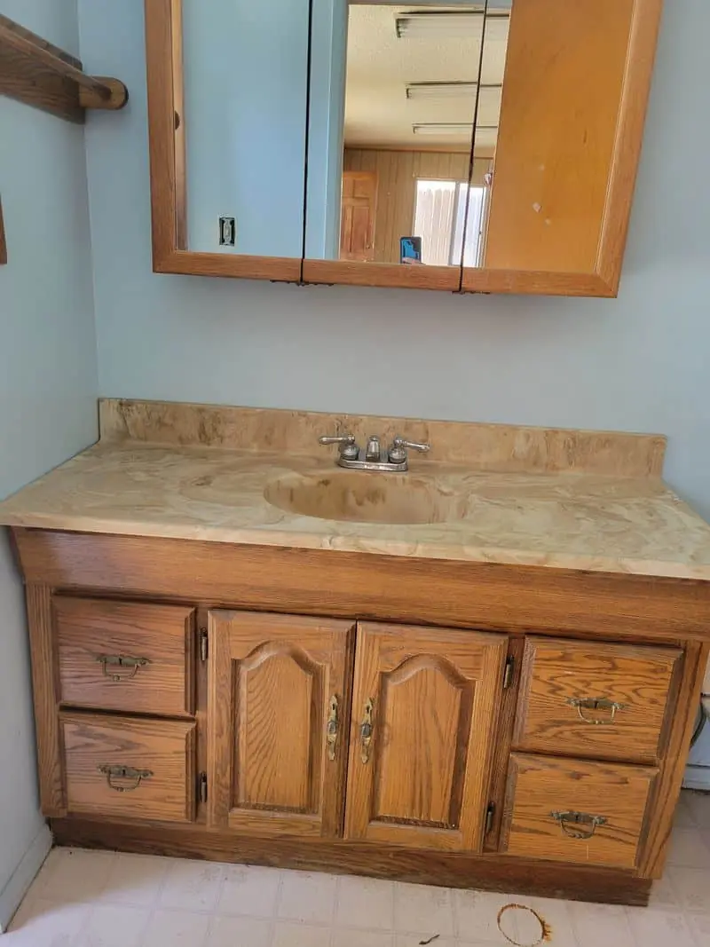 wooden vanity cabinet under the sink